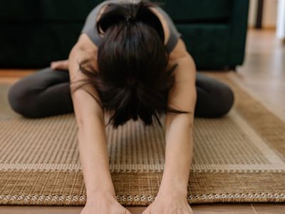Calm person meditating during stretching exercises
